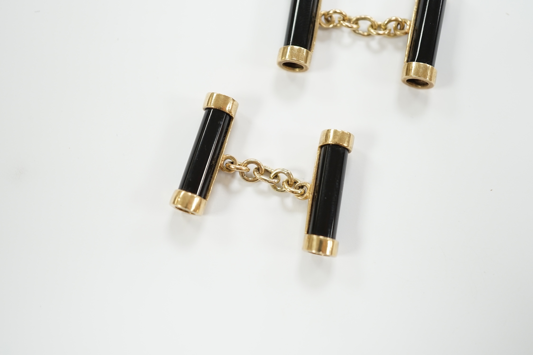 A pair of 9ct gold and black onyx baton shaped cufflinks, 22mm, gross weight 9.5 grams.